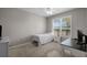 Bedroom includes a large window and neutral decor with space for a desk at 5000 Culbreath Key Way # 1-112, Tampa, FL 33611