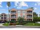 Multi-story condo building with private screened balconies and lush landscaping at 5000 Culbreath Key Way # 1-112, Tampa, FL 33611