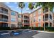 Multi-story condo building with private screened balconies and reserved parking spaces at 5000 Culbreath Key Way # 1-112, Tampa, FL 33611