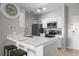 Well-equipped kitchen with modern appliances, breakfast bar, and ample storage at 5000 Culbreath Key Way # 1-112, Tampa, FL 33611