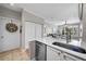 A lovely open kitchen showcases a stainless steel dishwasher, and granite countertops at 5000 Culbreath Key Way # 1-112, Tampa, FL 33611