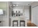 Charming kitchen featuring white cabinets, stainless steel appliances, and a breakfast bar with seating at 5000 Culbreath Key Way # 1-112, Tampa, FL 33611