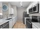 Charming kitchen with stainless steel appliances and modern countertops at 5000 Culbreath Key Way # 1-112, Tampa, FL 33611
