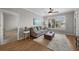 Comfortable living room space with lots of natural light, sofa, and wood floors at 5000 Culbreath Key Way # 1-112, Tampa, FL 33611