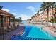 Resort-style community pool overlooking the marina with lounge chairs and tropical landscaping at 5000 Culbreath Key Way # 1-112, Tampa, FL 33611