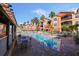 Community pool area with poolside lounge chairs and waterfront views at 5000 Culbreath Key Way # 1-112, Tampa, FL 33611