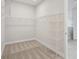 Spacious walk-in closet with ample shelving and hanging space for organized storage at 5178 Everlong Dr, Apollo Beach, FL 33572