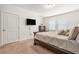 Bedroom with TV, large bed and two windows at 5521 Yellowfin Ct, New Port Richey, FL 34652