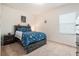 bedroom with themed bedding, window and nightstand at 5521 Yellowfin Ct, New Port Richey, FL 34652