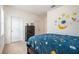 Bedroom with themed bedding, dresser, and wall decals at 5521 Yellowfin Ct, New Port Richey, FL 34652