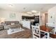 Open-concept living space featuring kitchen, dining area, and cozy living room with natural light at 5521 Yellowfin Ct, New Port Richey, FL 34652