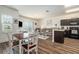 Bright open floor plan with wood flooring, modern kitchen, and comfortable living area at 5521 Yellowfin Ct, New Port Richey, FL 34652