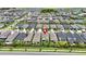 Aerial view of a neighborhood featuring many homes, a pond, and a red pin marking the property at 5611 Del Coronado Dr, Apollo Beach, FL 33572