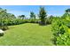 Expansive backyard with well-maintained grass and landscaping, perfect for outdoor enjoyment at 5611 Del Coronado Dr, Apollo Beach, FL 33572