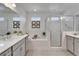 Bright bathroom showcasing a soaking tub, a glass shower, and a double sink vanity at 5611 Del Coronado Dr, Apollo Beach, FL 33572
