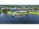 Aerial view showcasing community amenities of a pool and recreation center by the lake at 5611 Del Coronado Dr, Apollo Beach, FL 33572
