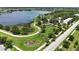 Scenic view of a community park with a walking path and a lake at 5611 Del Coronado Dr, Apollo Beach, FL 33572