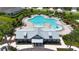 Overhead view of community pool and recreation center with surrounding landscaping and lounge chairs at 5611 Del Coronado Dr, Apollo Beach, FL 33572