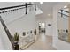 Bright foyer featuring tiled floors, staircase, and stylish decor with a modern console table at 5611 Del Coronado Dr, Apollo Beach, FL 33572