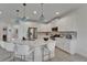 Open kitchen with seating at the island and stainless steel appliances at 5611 Del Coronado Dr, Apollo Beach, FL 33572