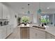 Modern kitchen featuring stainless steel appliances and a center island at 5611 Del Coronado Dr, Apollo Beach, FL 33572