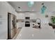 Bright kitchen featuring white cabinetry, stainless appliances and stylish pendants at 5611 Del Coronado Dr, Apollo Beach, FL 33572
