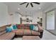 Open-concept living room and kitchen with white cabinets and stainless appliances at 5611 Del Coronado Dr, Apollo Beach, FL 33572