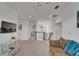 Upstairs loft features comfortable seating, a TV, and a view of a Bedroom at 5611 Del Coronado Dr, Apollo Beach, FL 33572