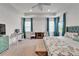 Spacious main bedroom with a ceiling fan, a comfortable sitting area and bright light from multiple windows at 5611 Del Coronado Dr, Apollo Beach, FL 33572
