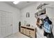 Neat mud room with a wooden console table, stylish decor, and convenient storage hooks at 5611 Del Coronado Dr, Apollo Beach, FL 33572