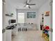 Home office featuring neutral walls, tiled floors, modern furniture, and natural light at 5611 Del Coronado Dr, Apollo Beach, FL 33572