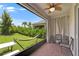Cozy screened patio with outdoor seating, a hammock, and a peaceful backyard view at 5611 Del Coronado Dr, Apollo Beach, FL 33572
