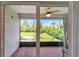 Outdoor patio with brick floors, a ceiling fan, and a view of the lawn at 5611 Del Coronado Dr, Apollo Beach, FL 33572