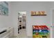 Bright playroom with storage shelves and colorful toy organizers, perfect for keeping things tidy at 5611 Del Coronado Dr, Apollo Beach, FL 33572
