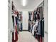 A large walk-in closet featuring ample storage with shelving and hanging space for clothes at 5611 Del Coronado Dr, Apollo Beach, FL 33572