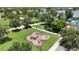 Community workout area with various exercise stations surrounded by lush landscaping at 5611 Del Coronado Dr, Apollo Beach, FL 33572