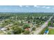 Aerial view of a charming neighborhood near the ocean with lush trees and clear blue skies at 5895 16Th N St, St Petersburg, FL 33703
