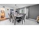 Inviting dining area with a chandelier, seating for six, and tiled floors, perfect for Gathering dinners at 5895 16Th N St, St Petersburg, FL 33703