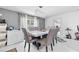 Elegant dining room featuring a modern chandelier, table with seating, and bright natural light at 5895 16Th N St, St Petersburg, FL 33703