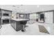 Open concept kitchen with island, stainless appliances, and easy flow to the living area at 5895 16Th N St, St Petersburg, FL 33703