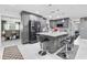 Spacious gray kitchen features a center island with bar stools, modern appliances, and tile flooring at 5895 16Th N St, St Petersburg, FL 33703