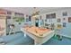Basement with pool table, bar area, and kitchenette, creating the perfect space for recreation and entertaining at 6107 Marbella Blvd, Apollo Beach, FL 33572
