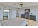 This bedroom features a ceiling fan and a mirrored closet at 6107 Marbella Blvd, Apollo Beach, FL 33572