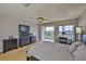 This spacious bedroom features a balcony and a work space at 6107 Marbella Blvd, Apollo Beach, FL 33572