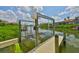 Features include a private boat lift and dock with clear, navigable water, perfect for boating enthusiasts at 6107 Marbella Blvd, Apollo Beach, FL 33572