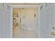 Bright foyer with tiled floors, an open view to the dining area, and neutral decor creates a welcoming entrance at 6107 Marbella Blvd, Apollo Beach, FL 33572