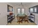Cozy game room with a poker table, ceiling fan, and french doors for outdoor access at 6107 Marbella Blvd, Apollo Beach, FL 33572