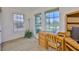 Cozy home office featuring wood floors, a desk, and a window view at 6107 Marbella Blvd, Apollo Beach, FL 33572