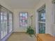 Light-filled office space with french doors, wood floors, and a window view at 6107 Marbella Blvd, Apollo Beach, FL 33572