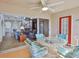 Inviting lanai with modern furniture overlooking the living room and staircase at 6107 Marbella Blvd, Apollo Beach, FL 33572